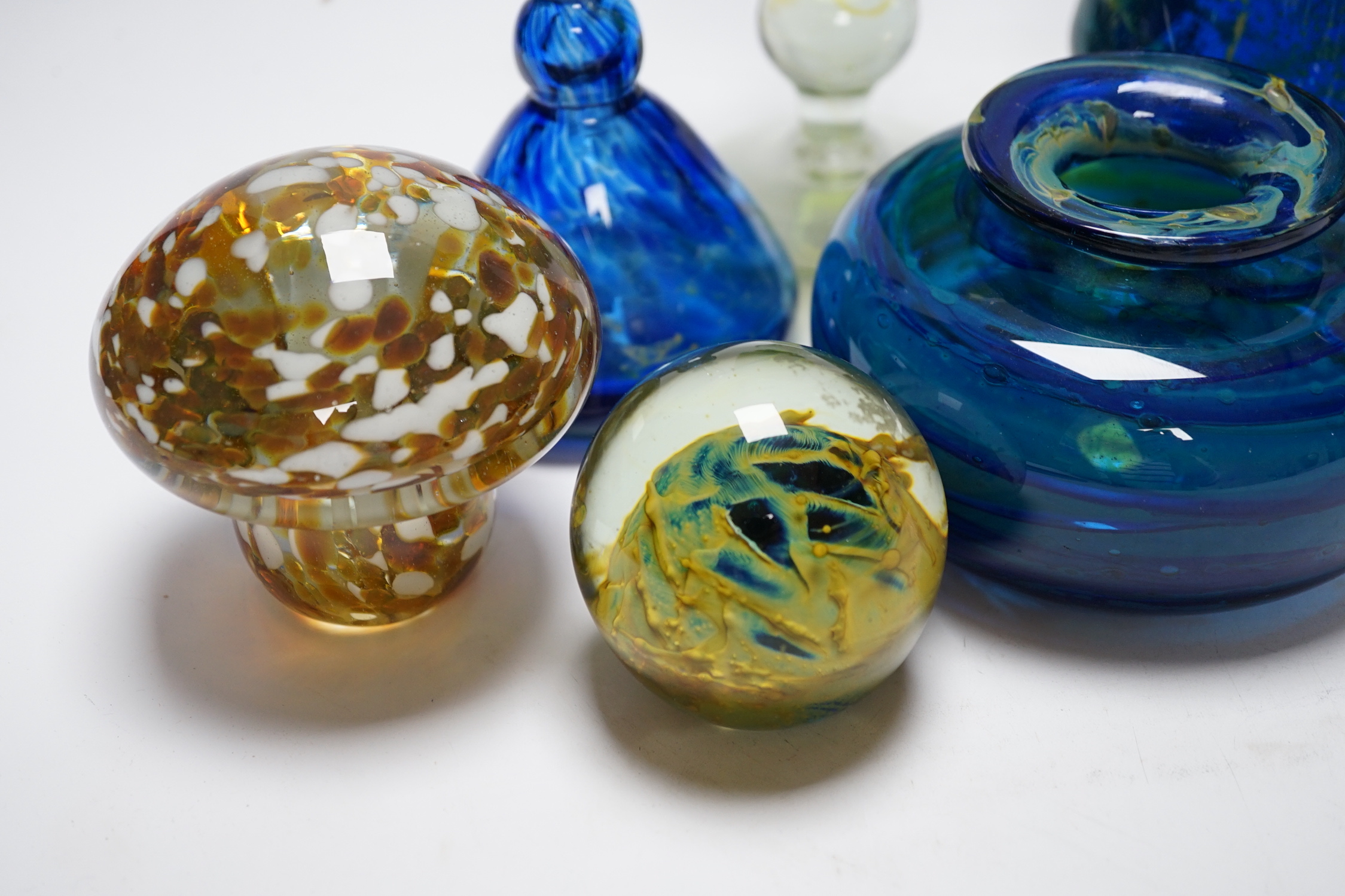 A group of Mdina glass comprising three vases, a stemmed glass, three paper weights and a scent bottle and stopper, (8) tallest 22cms high